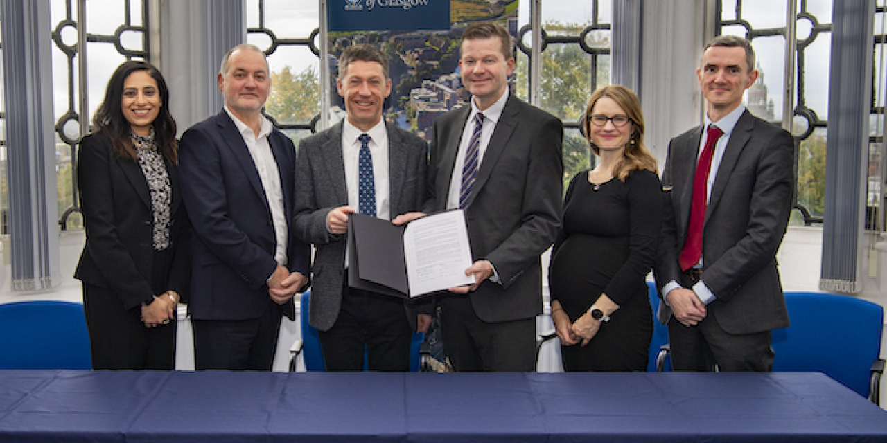 Senior staff from the University of Glasgow and Glasgow Clyde College gather to sign the MoU