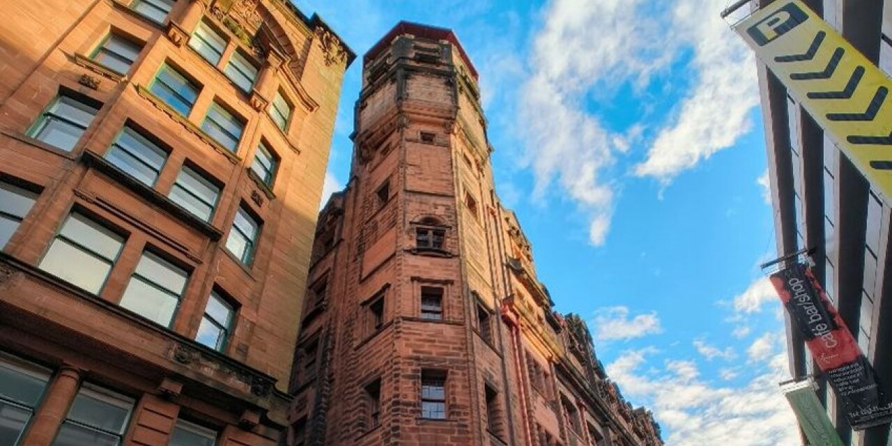 The Lighthouse - a red sandstone building - towers above Mitchell Lane.